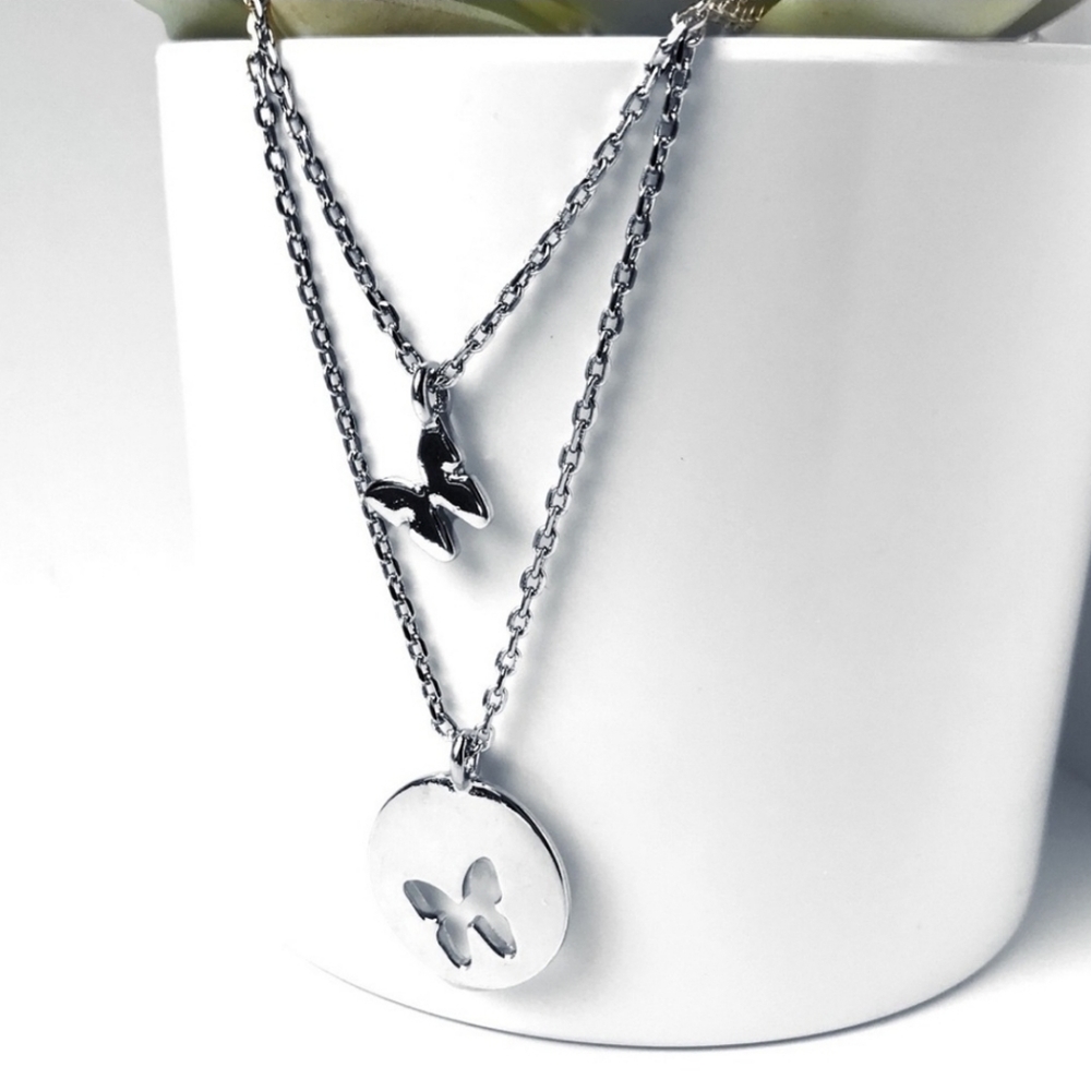 Silver toned gorgeous butterfly pendant and hollow coin necklace set